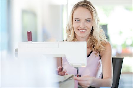 sewing machine woman - Dressmaker working in studio Stock Photo - Premium Royalty-Free, Code: 614-06718518