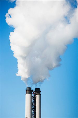 smoke - Smoke billowing from industrial plant Stock Photo - Premium Royalty-Free, Code: 614-06718554