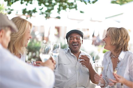 retirement outdoors - Older friends having wine together Stock Photo - Premium Royalty-Free, Code: 614-06718717