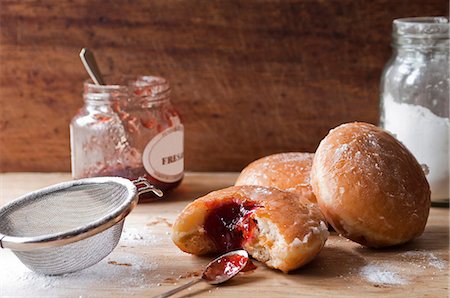 sweet treats - Doughnuts, jam and sugar on table Stock Photo - Premium Royalty-Free, Code: 614-06718733