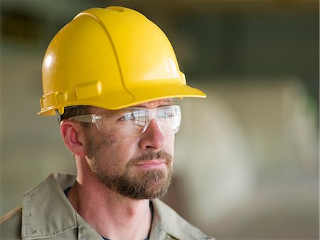 Engineer wearing hard hat on site Stock Photo - Premium Royalty-Free, Code: 614-06718858