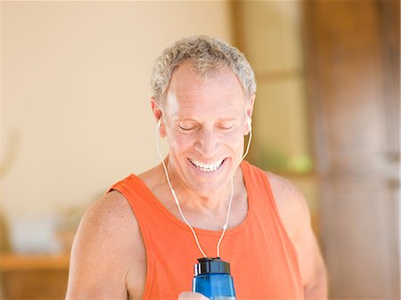 Older man working out at home Stock Photo - Premium Royalty-Free, Code: 614-06718872