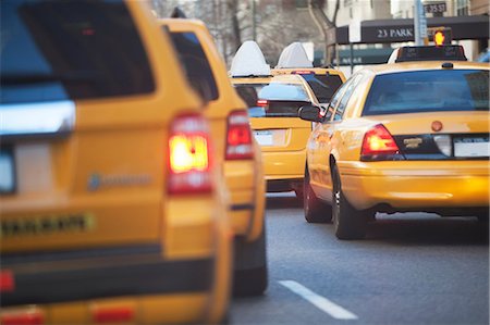 Taxis sitting in city traffic Stock Photo - Premium Royalty-Free, Code: 614-06718984