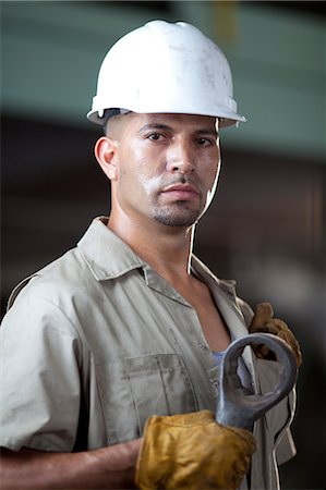 people adult man portrait serious eye contact 30s - Industrial worker in plant Stock Photo - Premium Royalty-Free, Code: 614-06719119