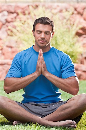 Man meditating outdoors Stock Photo - Premium Royalty-Free, Code: 614-06719139