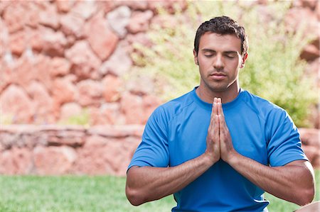 Man meditating outdoors Stock Photo - Premium Royalty-Free, Code: 614-06719140