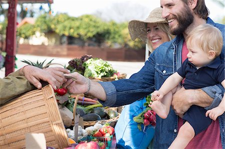 family shopping at farmers market - Family shopping at farmer's market Stock Photo - Premium Royalty-Free, Code: 614-06719236