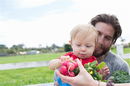 family at market - Father and son at farmer's market Stock Photo - Premium Royalty-Free, Code: 614-06719256