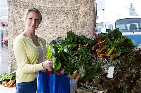 Woman shopping at farmer's market Stock Photo - Premium Royalty-Free, Code: 614-06719285