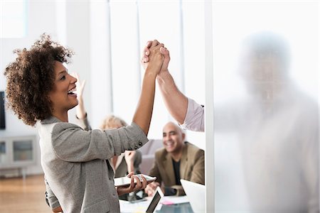 simsearch:6113-07543445,k - Business people shaking hands in office Stock Photo - Premium Royalty-Free, Code: 614-06719387