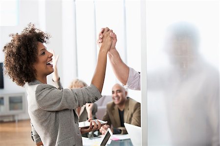 simsearch:6113-06497888,k - Business people shaking hands in office Stock Photo - Premium Royalty-Free, Code: 614-06719387