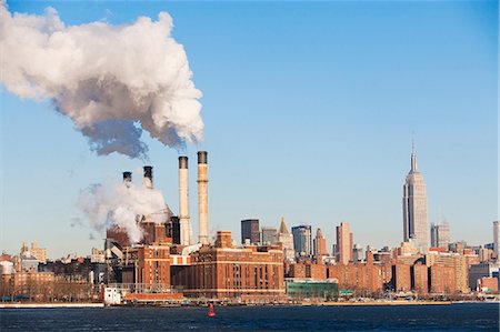 pollution urban usa - Smoke billowing from industrial plant Stock Photo - Premium Royalty-Free, Code: 614-06719495