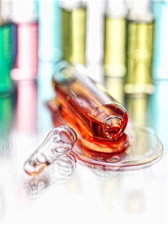 drug - Close up of spilled vial of liquid Stock Photo - Premium Royalty-Free, Code: 614-06719540