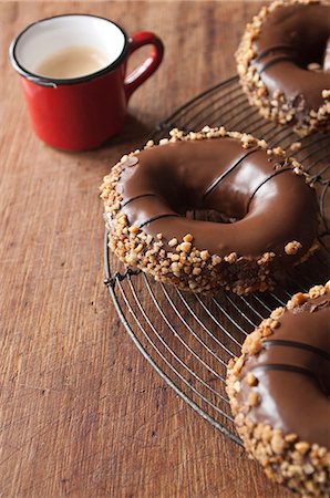 doughnuts and coffee - Close up of decorated doughnuts Stock Photo - Premium Royalty-Free, Code: 614-06719580