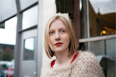 portrait looking away not happy - Woman standing on city street Stock Photo - Premium Royalty-Free, Code: 614-06719636