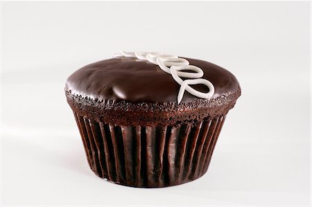 Close up of chocolate cupcake Stock Photo - Premium Royalty-Free, Code: 614-06720045