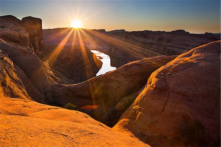 simsearch:6113-06626664,k - Sun rising over canyon rock formations Photographie de stock - Premium Libres de Droits, Code: 614-06720067