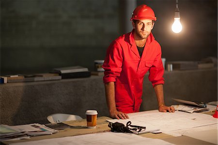 Building contractor working late on site Stock Photo - Premium Royalty-Free, Code: 614-06814035