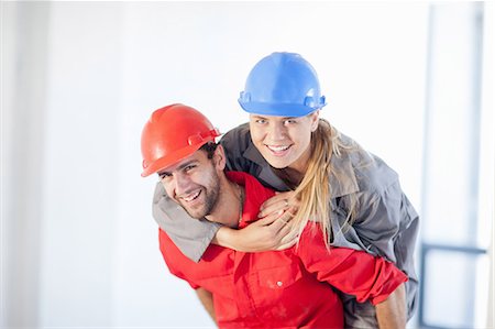 Young couple having fun on construction site Stock Photo - Premium Royalty-Free, Code: 614-06814041