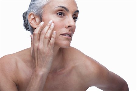 face woman senior - Mature woman touching face Stock Photo - Premium Royalty-Free, Code: 614-06814178