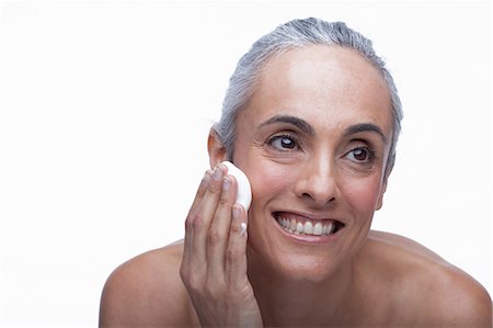 face woman senior - Mature woman cleansing face Stock Photo - Premium Royalty-Free, Code: 614-06814180