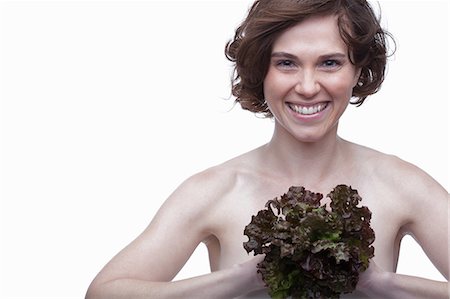 portrait woman short hair - Young woman with lettuce Stock Photo - Premium Royalty-Free, Code: 614-06814221