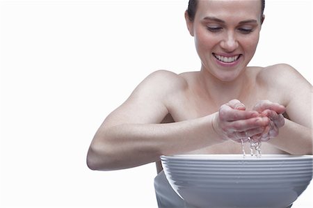 face and cleanse and one person - Young woman with bowl of water Stock Photo - Premium Royalty-Free, Code: 614-06814233