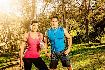 exercising with headphones - Two people having a rest from exercising Stock Photo - Premium Royalty-Free, Code: 614-06813178