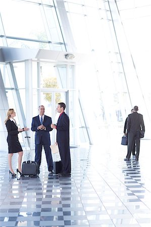 Businesspeople meeting in airport Stock Photo - Premium Royalty-Free, Code: 614-06813206