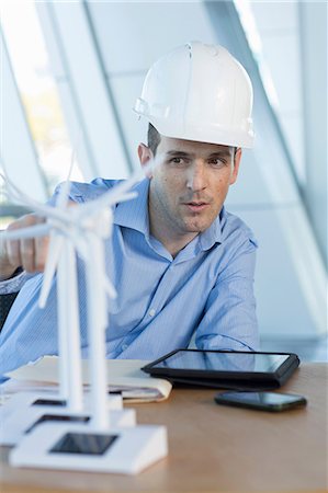 engineering - Engineer with model wind turbines Stock Photo - Premium Royalty-Free, Code: 614-06813258