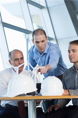 engineering construction - Engineers with model wind turbines Stock Photo - Premium Royalty-Free, Code: 614-06813252