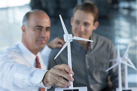 engineering construction - Engineers with model wind turbines Stock Photo - Premium Royalty-Free, Code: 614-06813261