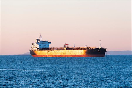 ship - Oil tanker at sunset Stock Photo - Premium Royalty-Free, Code: 614-06813315