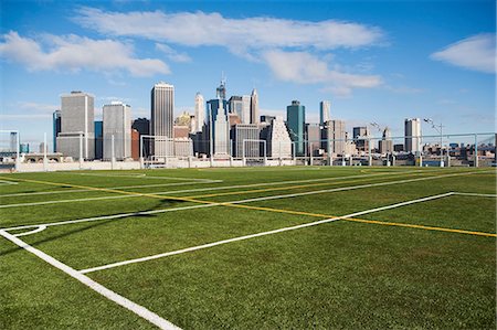 Soccer fields and Lower Manhattan skyline, New York City, USA Stock Photo - Premium Royalty-Free, Code: 614-06813338