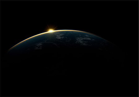 environment illustrations - Sunlight eclipsing planet earth Stock Photo - Premium Royalty-Free, Code: 614-06813423