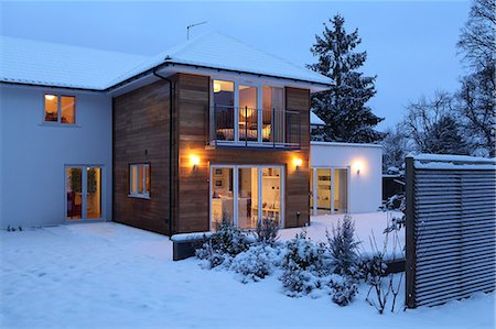 family modern - Illuminated family home in snow Stock Photo - Premium Royalty-Free, Code: 614-06813433