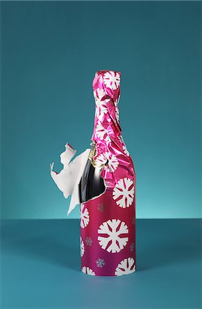 festive and wine - Bottle of bubbly wrapped in christmas paper Stock Photo - Premium Royalty-Free, Code: 614-06813440