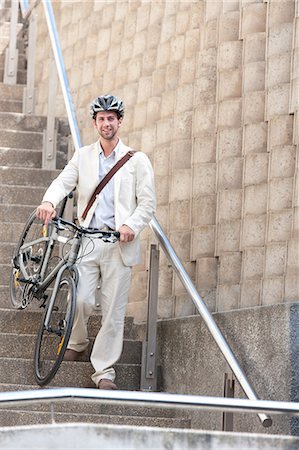 simsearch:614-02679479,k - Young man on steps with bicycle Foto de stock - Sin royalties Premium, Código: 614-06813822