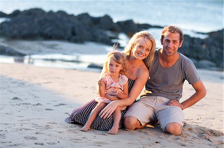 Young family with daughter on beach Stock Photo - Premium Royalty-Free, Code: 614-06813922