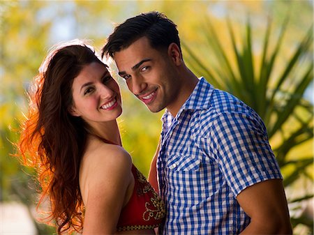 Young couple looking at camera, smiling Stock Photo - Premium Royalty-Free, Code: 614-06895992