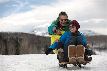 simsearch:614-06896003,k - Three friends sitting on sledge in snow Stockbilder - Premium RF Lizenzfrei, Bildnummer: 614-06896074