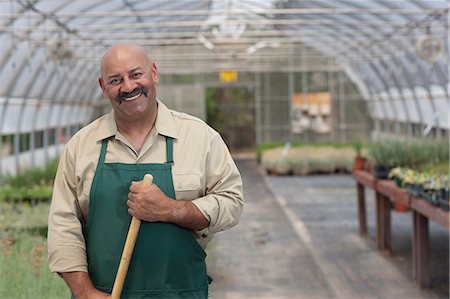 Mature man working in garden centre, portrait Foto de stock - Sin royalties Premium, Código: 614-06896229