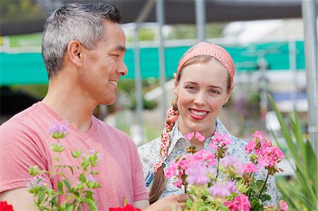 simsearch:614-06896204,k - Mature man and mid adult woman shopping in garden centre, smiling Stock Photo - Premium Royalty-Free, Code: 614-06896304