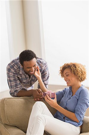 Man giving woman gift box Stock Photo - Premium Royalty-Free, Code: 614-06896455