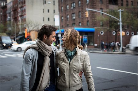 piétonne - Smiling couple walking together down city street Photographie de stock - Premium Libres de Droits, Code: 614-06896559