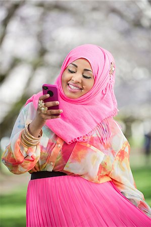 simsearch:649-08086479,k - Portrait of young female with matching mobile and  headscarf Stock Photo - Premium Royalty-Free, Code: 614-06897041