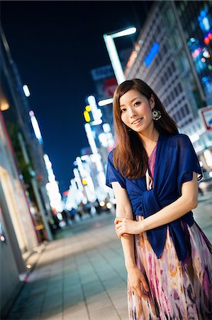 people city light - Portrait of young woman on city street at night Stock Photo - Premium Royalty-Free, Code: 614-06897341