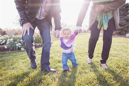 Grandparents walking granddaughter in garden Stockbilder - Premium RF Lizenzfrei, Bildnummer: 614-06897410