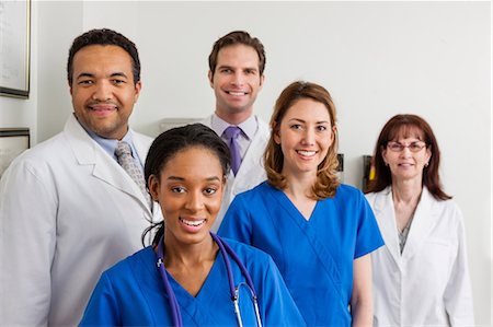 employee looking at camera - Medical professionals together in hospital, portrait Stock Photo - Premium Royalty-Free, Code: 614-06897474