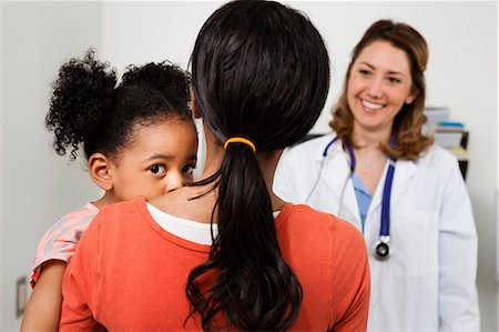 shy child adults - Young woman taking daughter to see doctor Stock Photo - Premium Royalty-Free, Code: 614-06897494